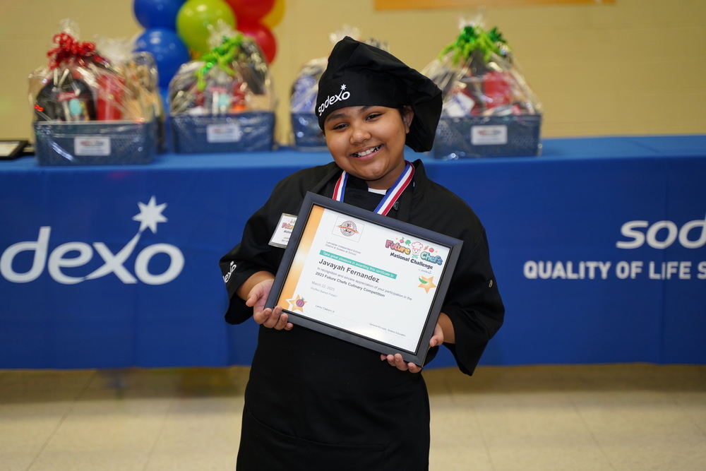 Javayah Fernandez poses with certificate